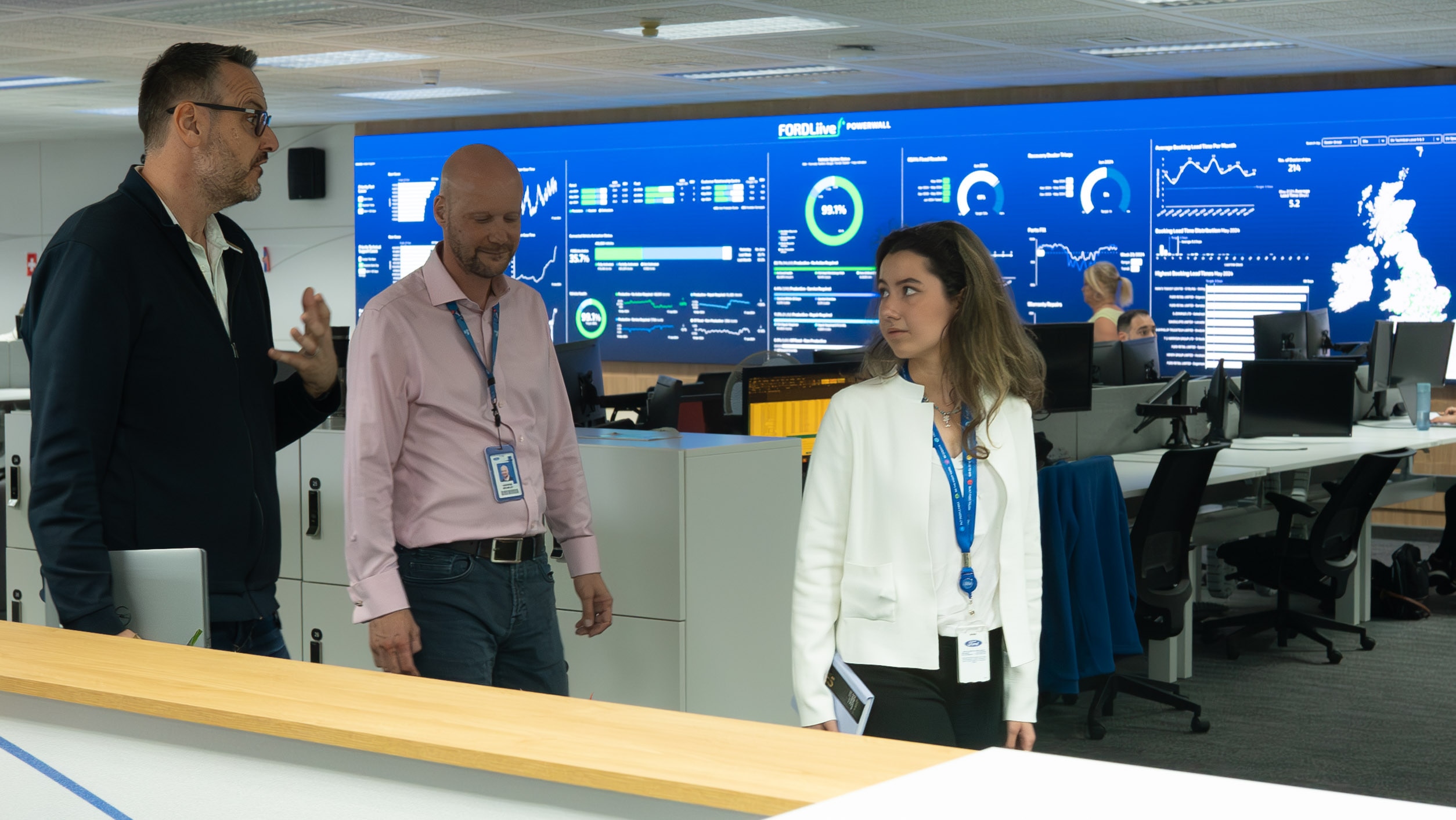 New UK Chief Engineer Hands Role to Student. Tatiana and Andrew in Ford Liive customer response centre with its manager Owen Gregory